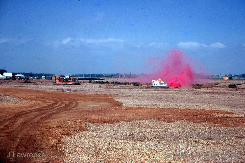 The SRN6 with the Inter-Service Hovercraft Trials Unit, IHTU - Flying around near the wind-direction marking smoke (Pat Lawrence).